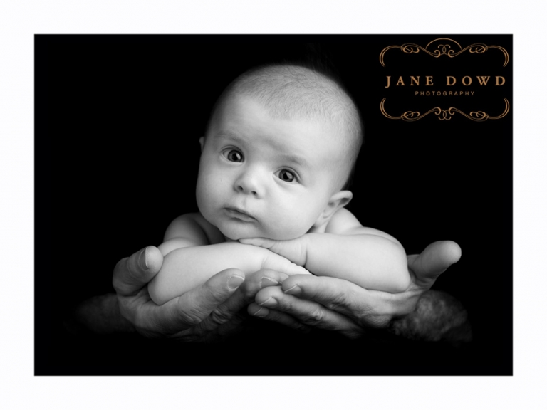 newborn in fathers hands